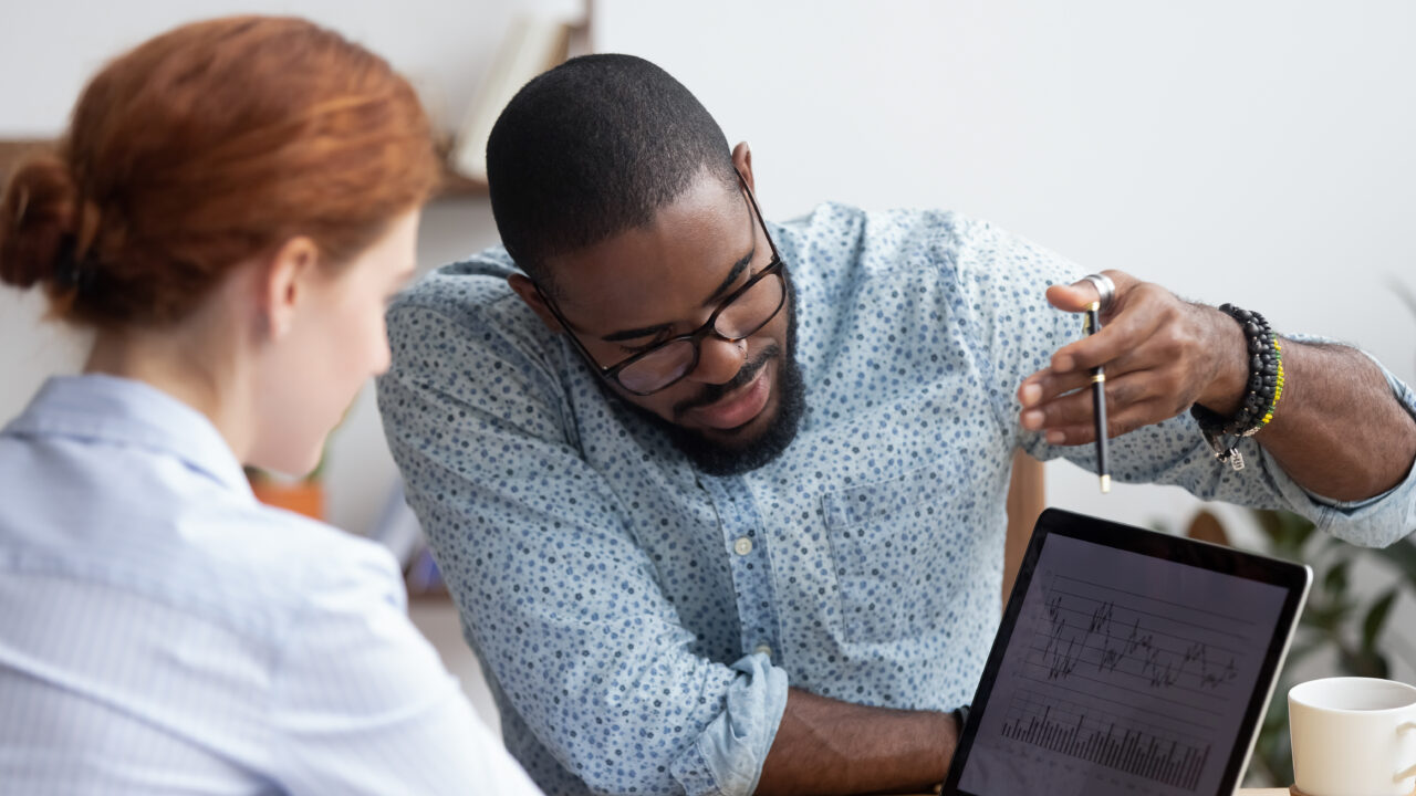 Association staff looking at member data sheets together