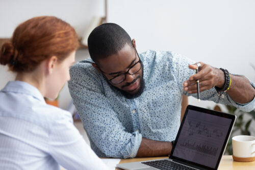 
                Association staff looking at member data sheets together