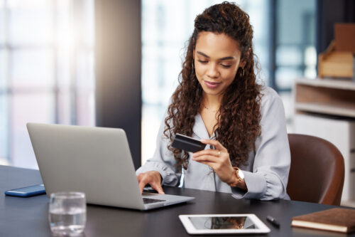 Woman processing a payment online.